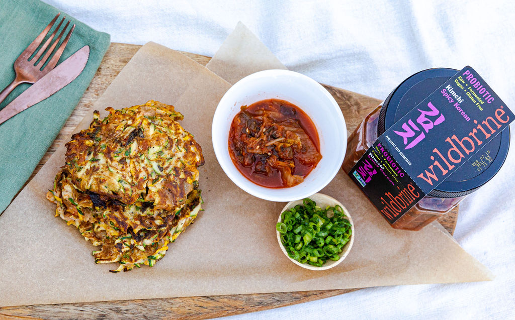 Zucchini Fritters with wildbrine kimchi on a platter