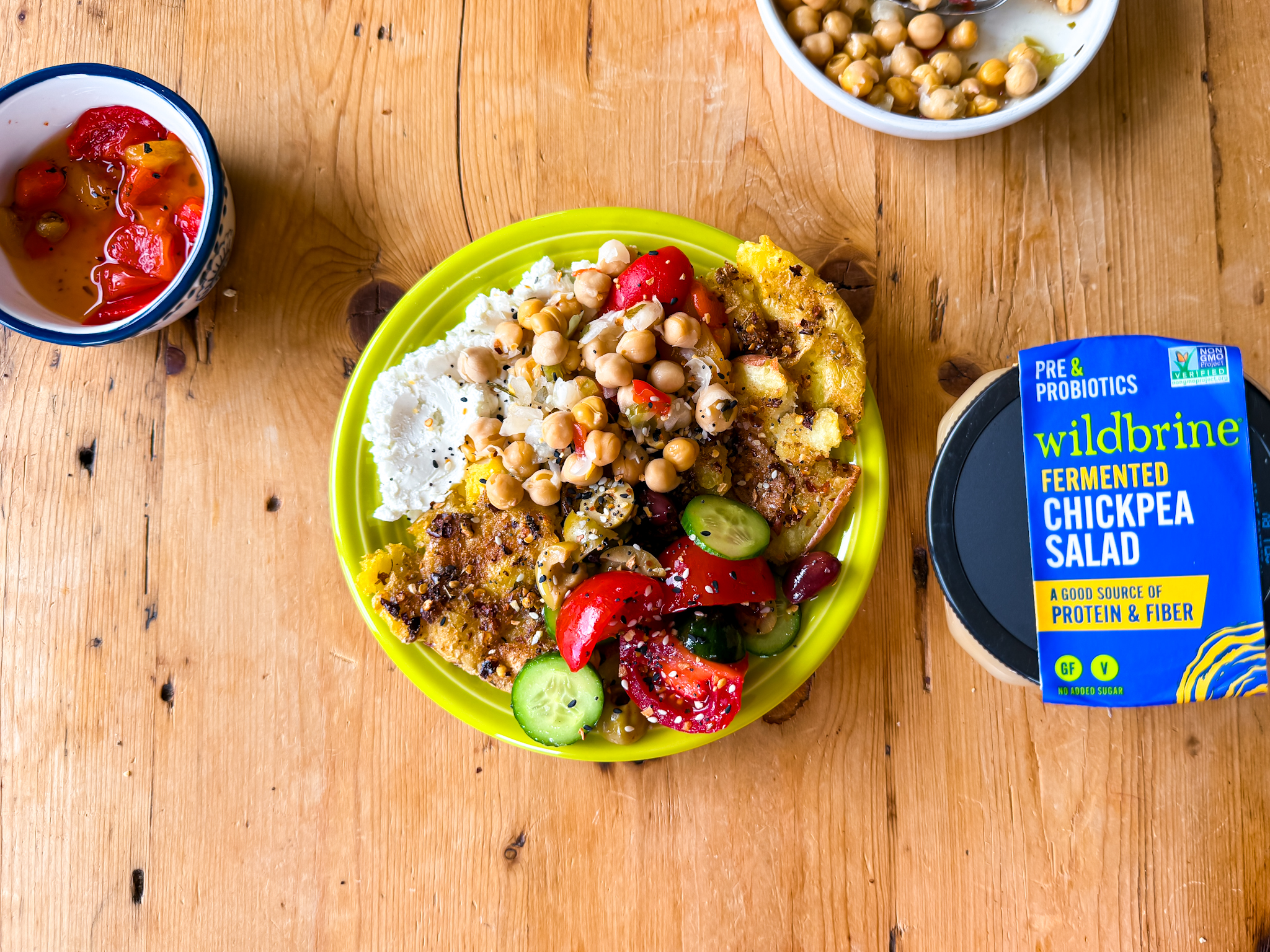 Wildbrine Mediterranean Fermented Chickpeas With Smashed Potatoes, Goat Cheese, and A Cucumber Tomato Salad