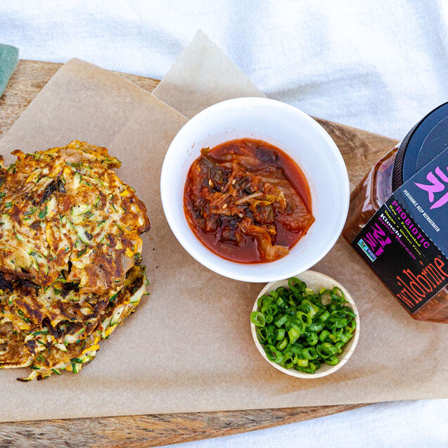 Zucchini Fritters with wildbrine kimchi on a platter